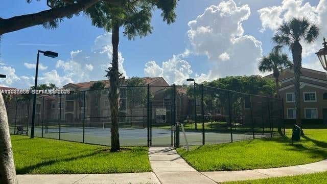 Photo of 8020 N Nob Hill Rd #205, Tamarac, FL 33321 (MLS # A12030936)