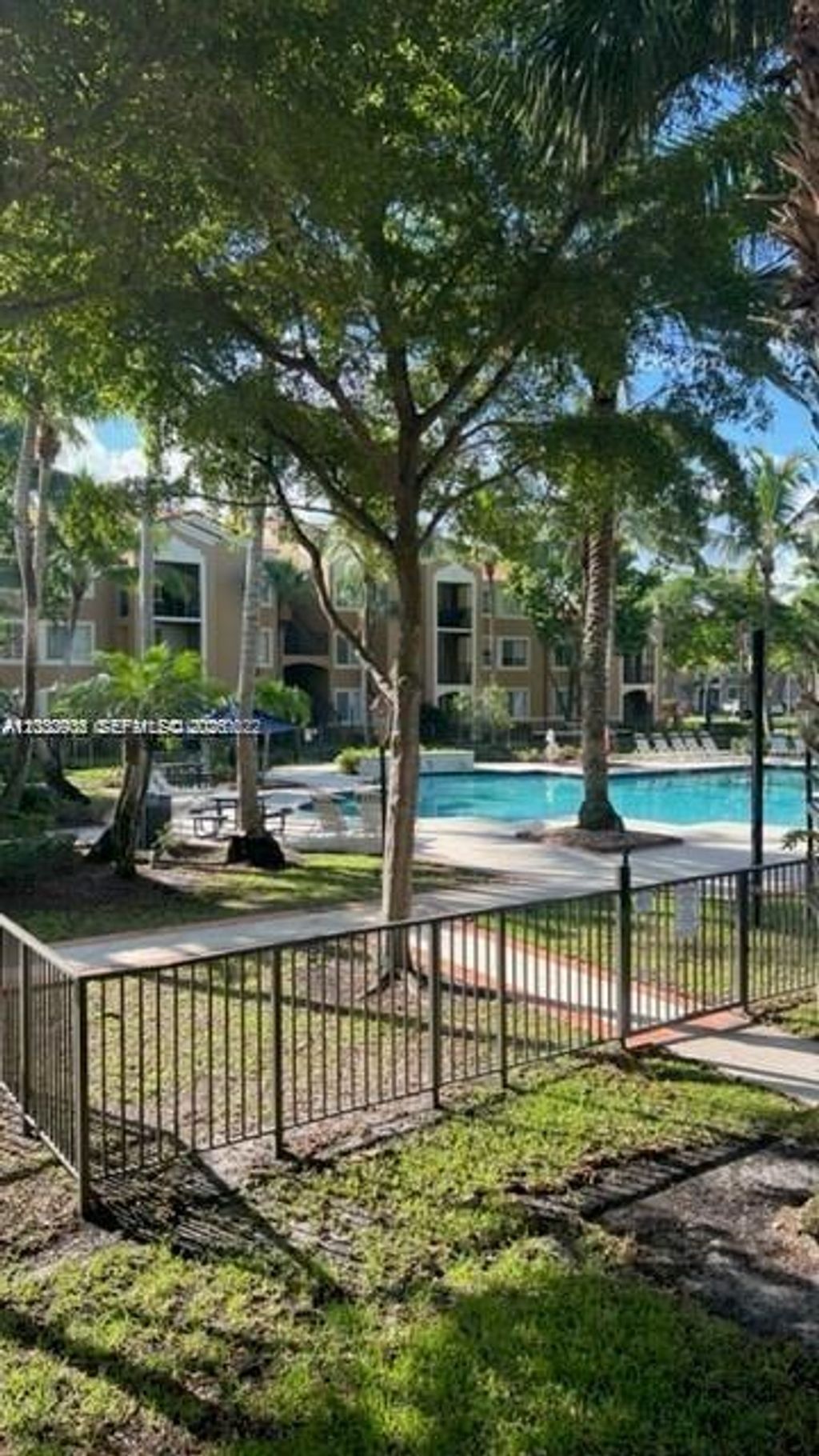 Photo of 8020 N Nob Hill Rd #205, Tamarac, FL 33321 (MLS # A12030936)