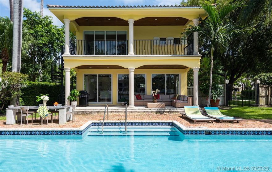 Exceptional WF home on guard gated Sunset Island I. Bright & spacious w/ a wealth of natural light complementing lg open spaces. Impressive formal LR overlooks the water & pool area, w/ built in bar, & adjacent formal DR w/ original fireplace. Lg eat-in kitchen w/center island, gas stove, subzero refrigerator, butler pantry w/ prep area, perfect for any chef. A comfortable & cozy family room flows effortlessly off the kitchen. Wonderful floor plan w/ 6 BDs up including a lg principal suite, 2 walk-in closets, luxurious principal bath w/ walk in shower & spa tub. Lg backyard adjacent to covered terrace faces pool w/ 70 ft of WF, no fixed bridges, dock, & boat lift. Housekeeper apt w/ separate entrance, 2 car garage, full house generator. Living is easy in this lush tropical setting.