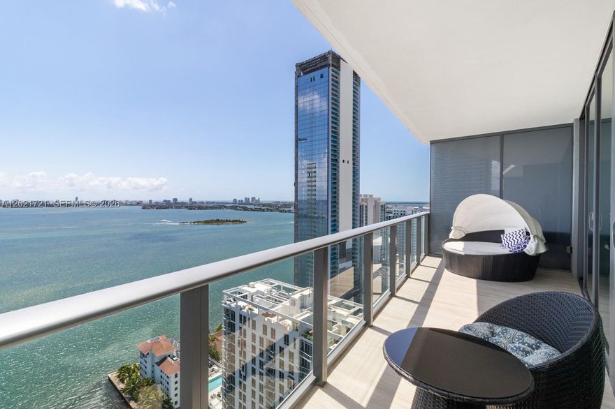 Enjoy breathtaking bay and ocean views from this stylish 2BD/2BA condo at Icon Bay. With 1,143 sq ft of living space, this modern residence offers the perfect blend of style and comfort. Private elevator foyer, floor-to-ceiling windows, porcelain floors and brand-new AC unit, washer, dryer, microwave, and electric blackout shades complement the space. The spacious balcony brings the serene waterfront right to you. Resort-style amenities include a bayfront infinity pool, tennis courts, spa, gym, and dog park, offering all that you need for a relaxing and convenient lifestyle. Includes 1 parking space assigned, plus valet for extra vehicles. Can be sold furnished or unfurnished. Building offers semi-flexible rental policy. Available immediately.