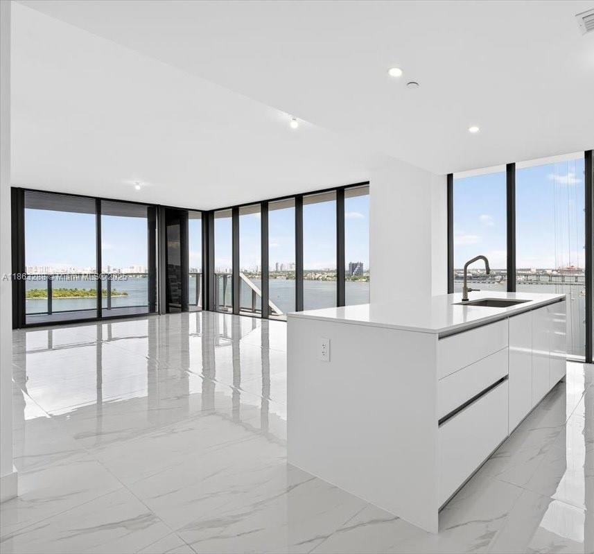 Be the first to own this stunning 4-Bedroom + Den, 5.5 Bath corner home at Aria Reserve. Move-in ready with built-in closets, mirrors, and shades, this residence offers gorgeous water views and a spacious balcony for indoor-outdoor living. Enjoy resort-style amenities and an unbeatable location just minutes from the Design District, Wynwood, and Miami Beach. This is your chance to own brand new waterfront luxury in the heart of Miami. Schedule your private tour today!