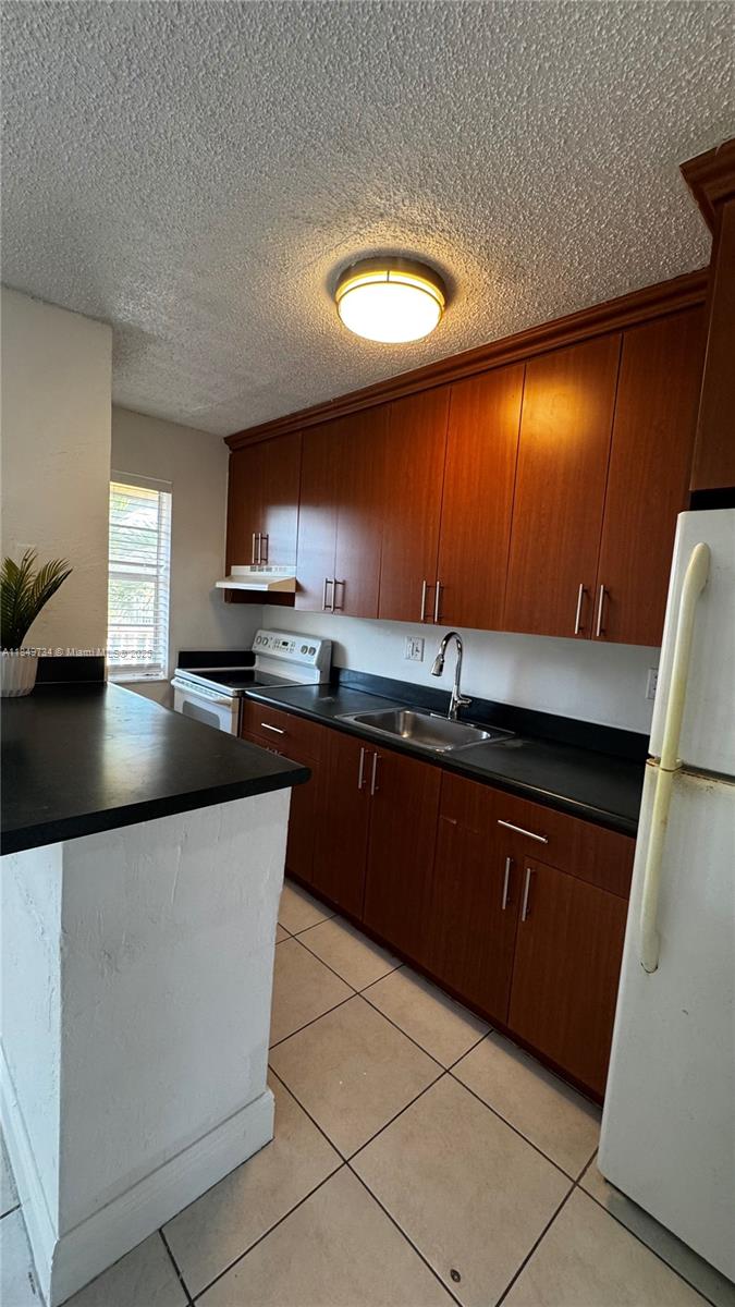 Centrally located in vibrant Oakland Park, this refreshed second floor unit offers comfort and convenience. Featuring tile flooring throughout, wall AC and painted in a bright white color, the apartment is clean, functional and move-in ready. Offered AS IS and priced below market value, this is a great opportunity for those seeking affordability in a prime location. Includes one parking space. Enjoy quick access to E. Commercial Blvd, E. Oakland Park Blvd, I-95, grocery stores, restaurants, entertainment, and just a 10 minute drive to the beach.
