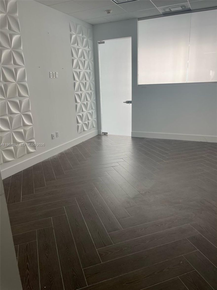 Small office in impeccable condition in a boutique office building.  This office features an open area and a private office.  Includes electricity, telephone, internet, and an assigned parking space.  Great location.