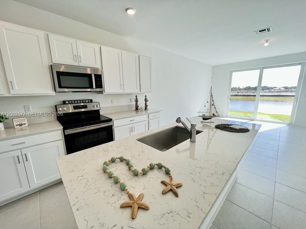 Photo of 212 SE Woodbark St, Port St Lucie, FL 34984 (MLS # A12002577)