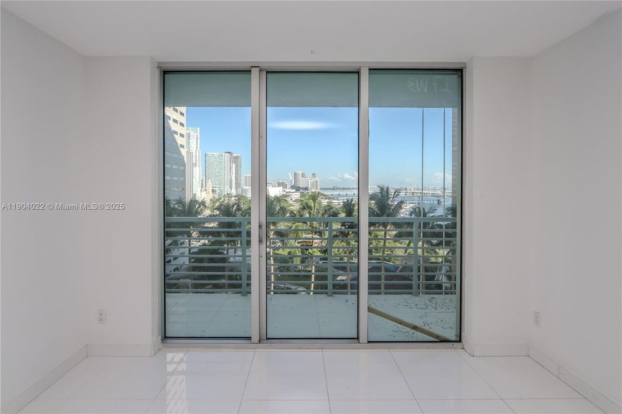Beautiful 2 Bedroom / 2 Bathroom Split-Plan Condo featuring direct views of Bayfront Park, Biscayne Bay, and the Miami Skyline. This residence offers modern porcelain tile floors throughout, a gourmet kitchen with wood cabinetry, granite countertops, and stainless-steel appliances, plus elegant marble bathroom counters. Enjoy resort-style living with building amenities that include two swimming pools, Jacuzzi, two fitness centers, sauna, party rooms, convenience store, 24-hour security, valet, and concierge service.
Prime downtown location—within close distance to Kaseya Center, Adrienne Arsht Center, and Brickell City Centre, and minutes to Key Biscayne, South Beach, Coconut Grove, Coral Gables, Wynwood, the Design District, and Miami International Airport.