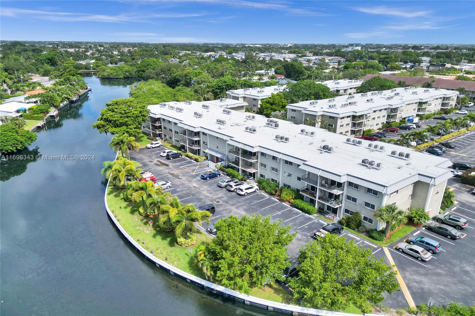 River Manor - all ages. Updated 3rd floor condo. New roof!  Freshly painted! Raised ceilings! Beautiful floors: entry is limestone tile, then brand new vinyl wood plank thru out. Open kitchen w/black granite countertops, knockdown finish on walls/ceilings. Updated bathrooms, Guest bath w/walk in shower/glass enclosure. Both BR have walk in closets. Impact windows & impact sliding door plus accordion shutters for extra protection! Common Laundry area on each floor. Rent includes: cable, internet and water. Walking distance to Wilton Drive, shops, restaurants, entertainment, Publix, Sprouts! Approx 2 miles to the beach! Screening takes 30 days so plan accordingly. Assigned parking #628 + guest. Community pool! Sorry - no pets per owner.  SEE VIDEO!