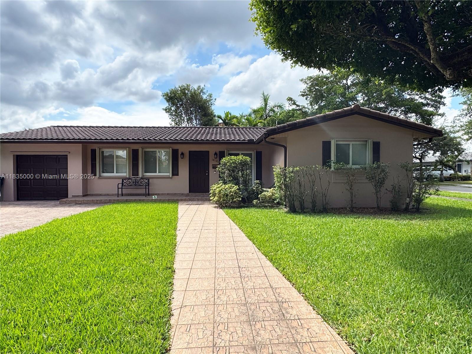 This maintained corner-lot home features 4 bedrooms and 2 bathrooms. The layout includes a formal living room, a bright dining area, and a family room that opens directly to the backyard.—right across from a tot lot with no front neighbors, giving you open views, extra privacy, and a safe spot for kids to play. This home has been upgraded, and improvements include a complete cast iron pipe replacement with PVC (2022), a new HVAC system (2023), a new roof (2011), impact glass windows and doors (2014), and impact shutters (2012). The expanded paver driveway (2018) offers plenty of space for parking and scooters, while the wood privacy fence (2019) adds security to the backyard. A new dryer (2024) and a full-house generator provide peace of mind for everyday living and unexpected outages.