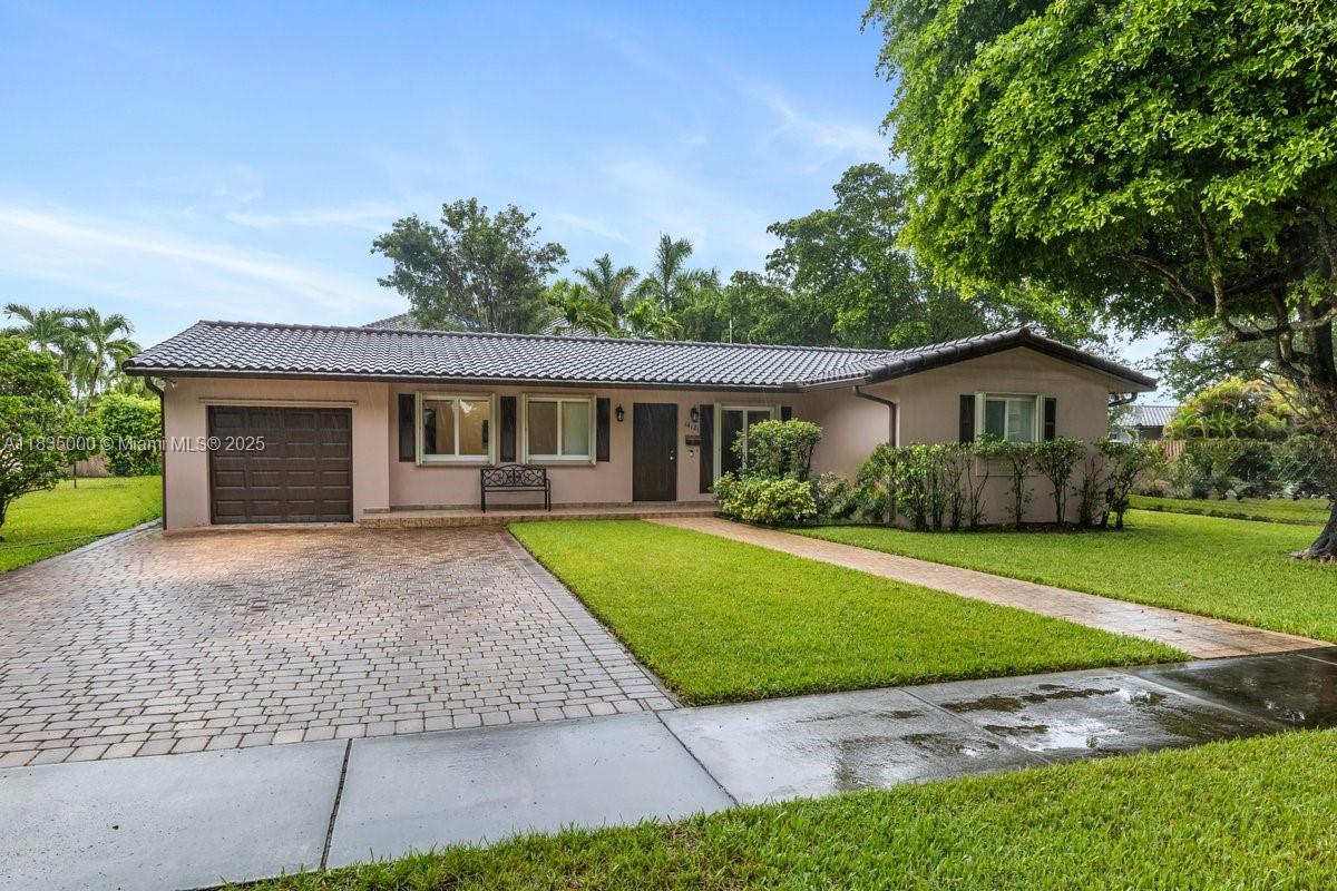 BEST PRICE IN MIAMI LAKES!! This maintained corner-lot home features 4 bedrooms and 2 bathrooms. The layout includes a formal living room, a bright dining area, and a family room that opens directly to the backyard. Across from a tot lot with no front neighbors, giving you open views. This home has been upgraded, and improvements include a complete cast iron pipe replacement with PVC (2022), a new HVAC system (2023), a newer roof (2011), impact glass windows and doors, a paver driveway, and a fenced-in backyard. A new dryer (2024) and a full-house generator. The kitchen is spacious, with ample cabinet space. The primary bedroom includes an en-suite bathroom and generous closet space. Each additional bedroom is well-sized and versatile—perfect for family, guests, or a home office setup.