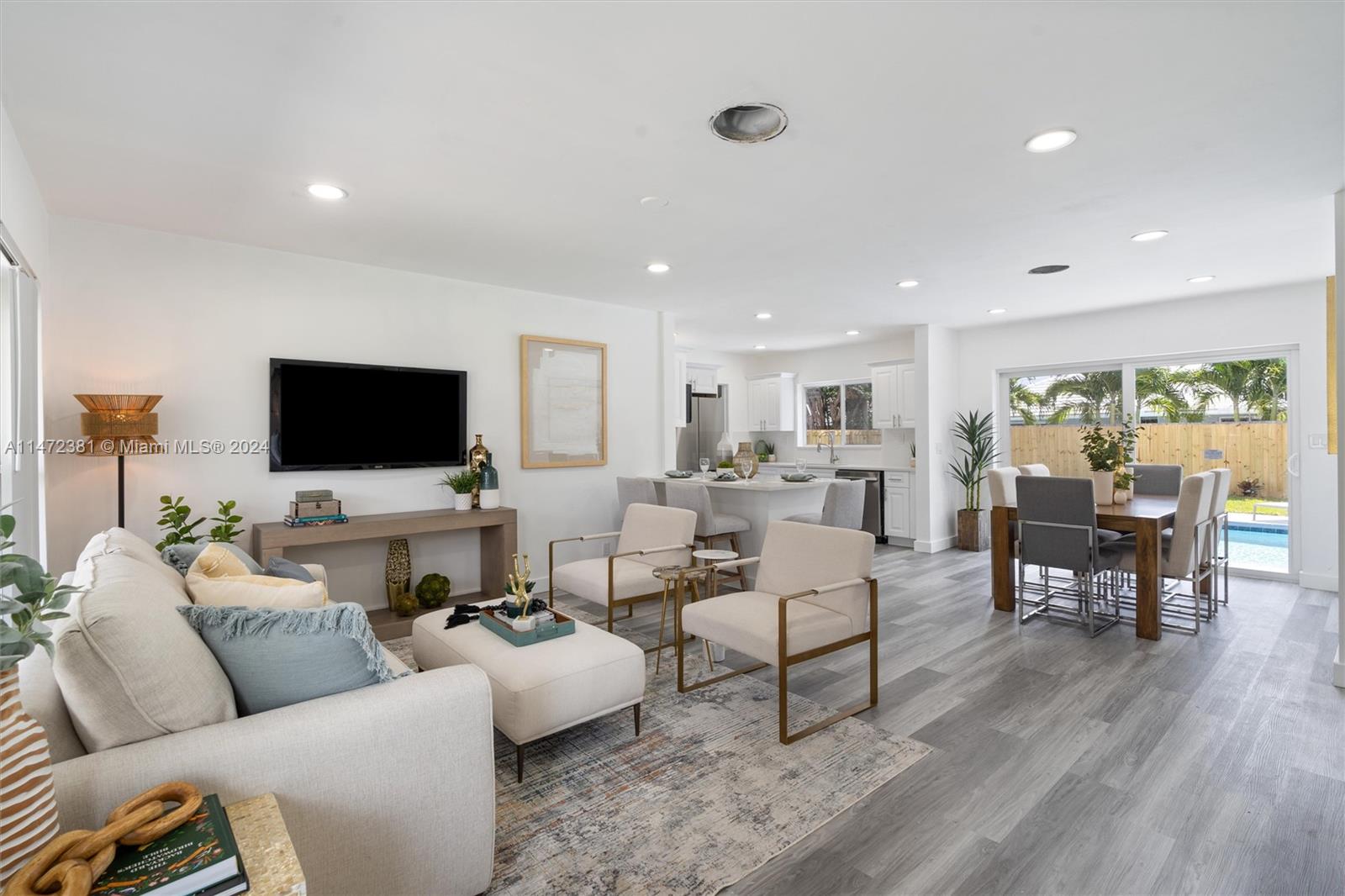 FINAL PRICE REDUCTIONS BEFORE OWNER KEEPS AS AIRBNB. Beautiful 3-bedroom, 2-bathroom home in the desirable Imperial Point neighborhood. This home is fully updated with a brand new metal-style roof done in 2022, brand new hurricane impact windows and doors in 2022, Brand NEW AC 2022, laminate flooring throughout, and an open kitchen concept with white cabinets and new stainless steel appliances. Washer and dryer included. Large backyard space with a pool for family and entertainment. The location is amazing. Right off of US-1 next to plenty of shopping, restaurants, and entertainment with an 8-minute drive to Fort Lauderdale Beach. DOM is high due to it previously being tenant occupied with difficulty showing. Home is now vacant and seller motivated!!!