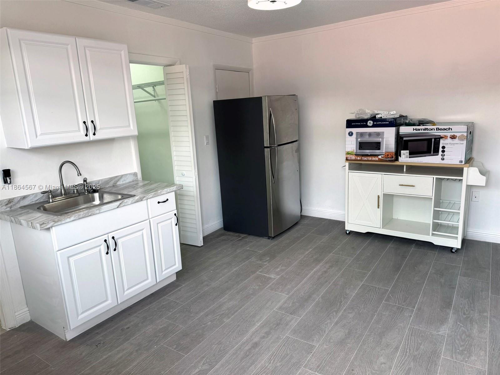 Be the first to live in this newly updated efficiency apartment! This thoughtfully designed space offers modern finishes throughout, perfect for anyone looking for style and convenience in a compact layout. Located in a central neighborhood. The unit has been fully refreshed with beautiful flooring throughout and a sleek new bathroom with standup shower. 1 Parking Space provided and private entrance. No Pets and No Smokers. All applicants must be interviewed via zoom or in person and we need a full background check of Credit/Criminal and Eviction history.