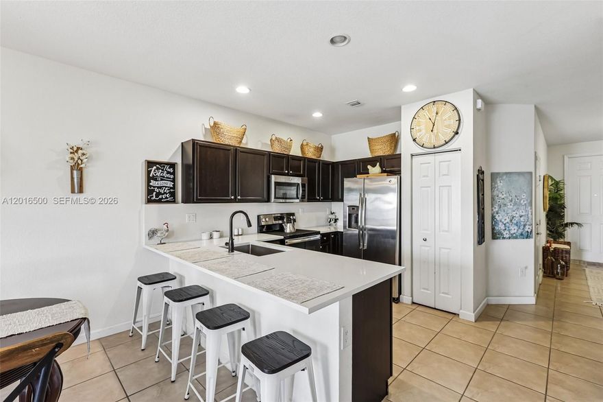 Beautifully maintained 3-bedroom, 2.5-bath townhome located in a gated community with resort-style amenities. This move-in ready home features an open and bright layout with abundant natural light throughout the day, upgraded quartz countertops, stainless steel appliances, and spacious living and dining areas perfect for entertaining.  All Bedrooms are well sized.  The private patio offers added peace and privacy with no rear neighbors. Pride of ownership is evident throughout the home. Enjoy a safe, well-kept community with excellent amenities including a resort-style pool and more. Conveniently located near shopping, dining, schools, and major highways. A fantastic opportunity for buyers looking for comfort, style, and low-maintenance living. This is the best one out there for under $400k!