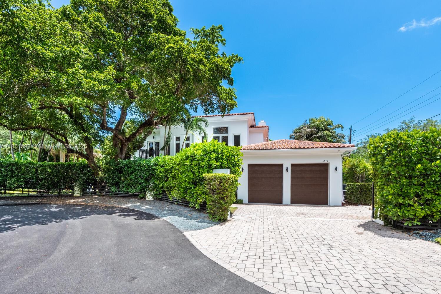 Stunning Modern Mediterranean Home in Coconut Grove
Set on a lush 14,000 SF lot at the end of a quiet cul-de-sac, this 2-story home blends luxury and comfort. Featuring 5 bedrooms and 6 bathrooms, each with a walk-in closet and ensuite. The chef-inspired kitchen boasts a large center island, perfect for entertaining, and the open-concept family room leads to the pool area, ideal for gatherings. Additional highlights include designer porcelain floors and wood floors, impact windows, a separate laundry room, and a 2-car garage. Close to parks, shopping, and dining, this home offers the best of Coconut Grove living