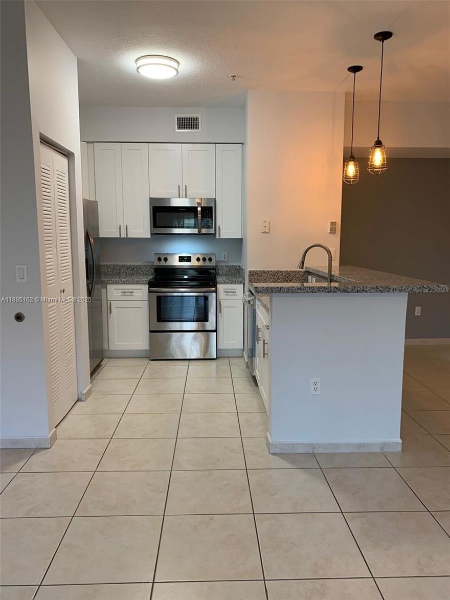 Live, learn, and play in Palm Gardens at Doral — a luxurious gated community with a clubhouse, swimming pool, and gym! This spacious 2-bedroom, 2-bath apartment features a renovated kitchen with granite countertops and stainless steel appliances, stylishly updated bathrooms, and tiled floors throughout. Hurricane-impact doors and windows provide peace of mind. Conveniently located near major expressways, and close to top-rated A+ elementary, middle, and high schools. Just minutes from renowned Doral malls and vibrant dining scenes. Two assigned parking spaces included. With strong community reserves and low maintenance fees, financing is available with low down payment options. An excellent opportunity for investors and first-time buyers — one of the best values in Doral!