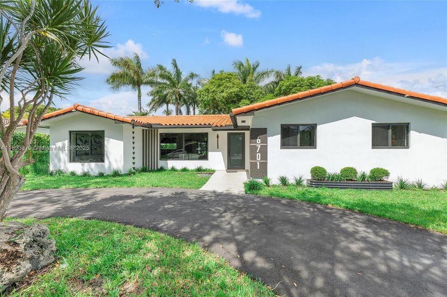 A vision of modern sophistication and effortless Miami living. This fully turn-key designer home welcomes you with a bright, open-concept layout filled with natural light. Features include porcelain floors, Calacatta quartz countertops, Italian-style kitchen cabinets with premium appliances and wine fridge, new pavement driveway, new impact doors and windows, and designer lighting throughout. The primary suite offers double sinks and custom floor-to-ceiling closets. A hidden paneled door for the half bath, den or family/TV room, and a spacious green yard with pergola and room for a pool complete the layout. The property shares limits with only one neighbor and sits on a nice dead-end street. Excellent location, minutes from Coral Gables and major highways. A true modern sanctuary.