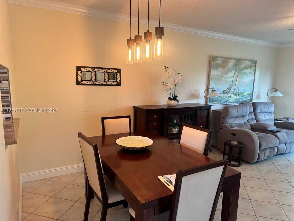 Photo of 5121 W Oakland Park Blvd #204, Lauderdale Lakes, FL 33313 (MLS # A11975797)