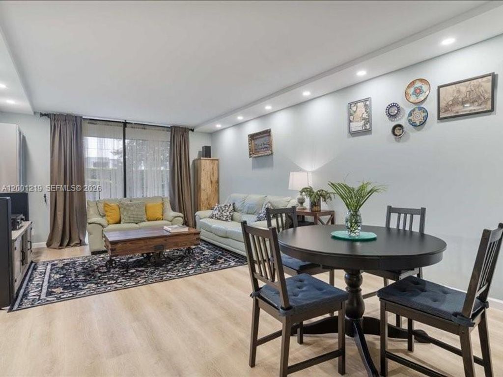 Photo of 6193 Rock Island Rd #105, Tamarac, FL 33319 (MLS # A12001219)