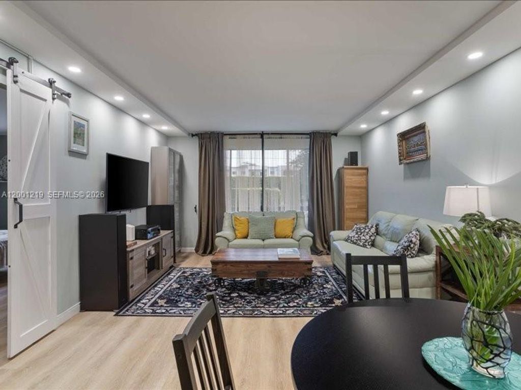 Photo of 6193 Rock Island Rd #105, Tamarac, FL 33319 (MLS # A12001219)