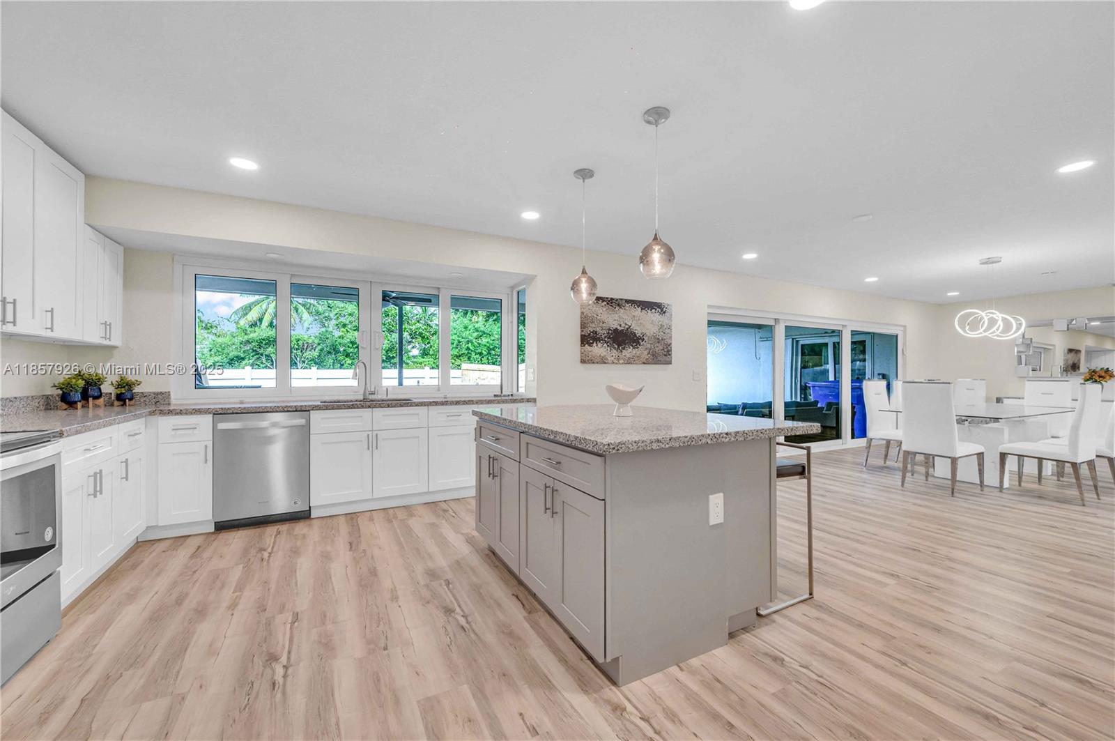 Designer-furnished and beautifully remodeled, this Hollywood Hills pool home offers the perfect balance of comfort, style, and indoor–outdoor living. Sunlit interiors feature large hurricane-impact windows, an open living/dining area, and spacious bedrooms, including a primary suite with a walk-in closet and spa-like bath with double vanity, soaking tub, and separate glass-enclosed shower. The second bath is equally updated with modern finishes. The sleek kitchen boasts stainless steel appliances, a glass cooktop, and an island for casual dining. Outside, a landscaped, gated backyard awaits with a sparkling pool and covered patio, perfect for BBQs and entertaining. Available furnished for a 6–10 month lease term, just minutes from shops, dining, and parks. South Florida living at its best.