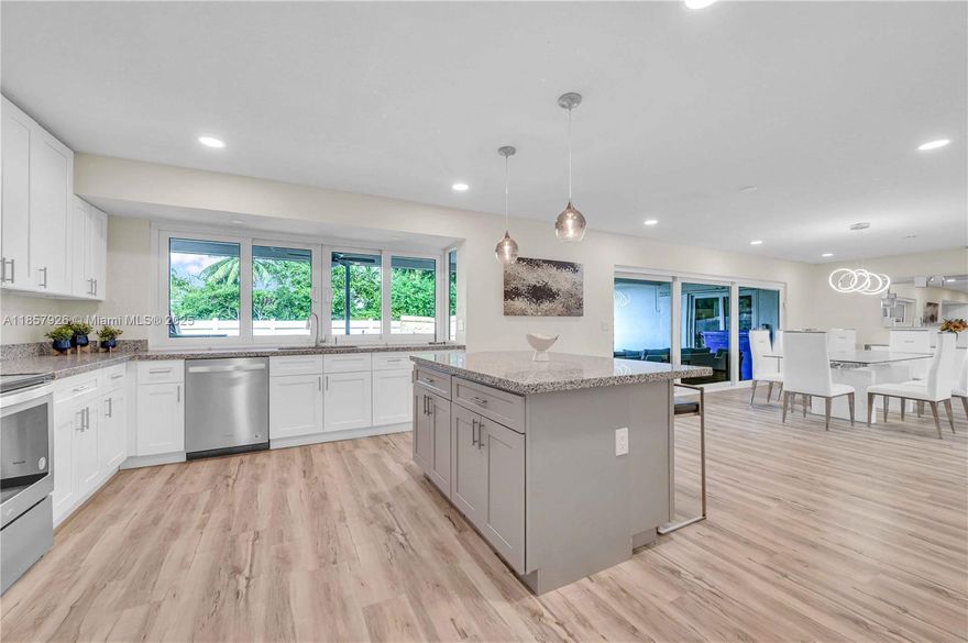 Designer-furnished and beautifully remodeled, this Hollywood Hills pool home offers the perfect balance of comfort, style, and indoor–outdoor living. Sunlit interiors feature large hurricane-impact windows, an open living/dining area, and spacious bedrooms, including a primary suite with a walk-in closet and spa-like bath with double vanity, soaking tub, and separate glass-enclosed shower. The second bath is equally updated with modern finishes. The sleek kitchen boasts stainless steel appliances, a glass cooktop, and an island for casual dining. Outside, a landscaped, gated backyard awaits with a sparkling pool and covered patio, perfect for BBQs and entertaining. Conveniently located minutes from shops, dining, and parks. South Florida living at its best. Available now, until July 2026.