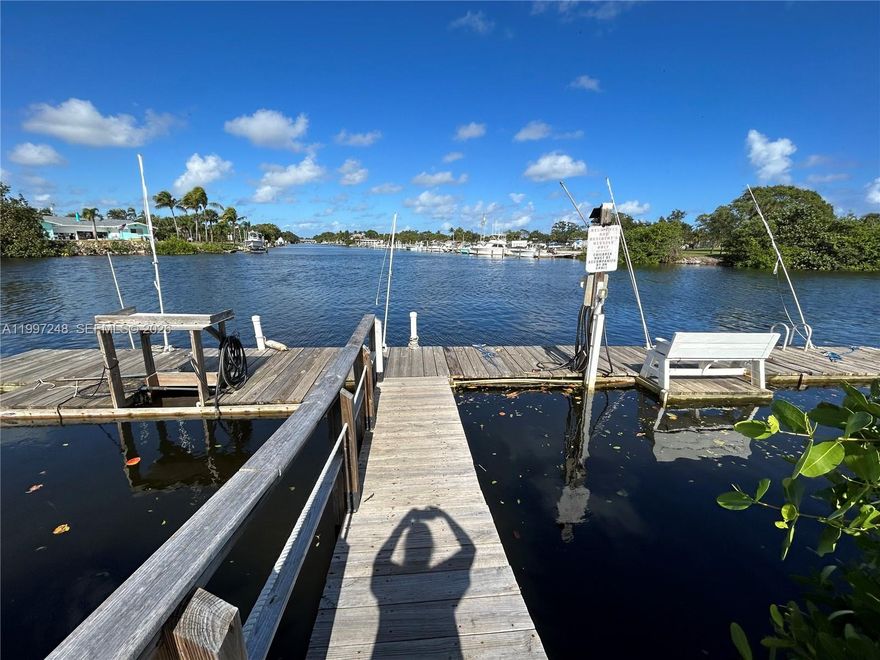 Live on the water with direct ocean access! This charming second-floor condo offers a clean private retreat with thoughtful updates. Features include new flooring, fresh paint, modern kitchen with new appliances, both bedrooms have new closets. bathroom is ready for your personal touch. Enjoy serene views overlooking the pool, intracoastal, community grilling area perfect for relaxing and entertaining. Dedicated parking space with option to purchase furnished