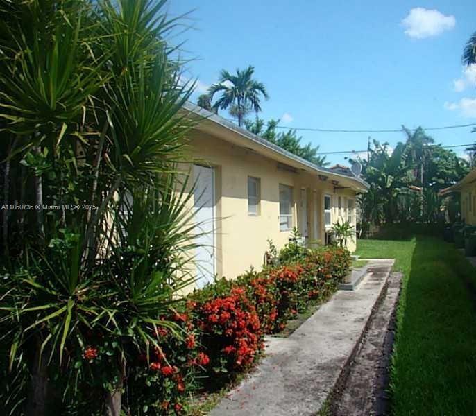 Location! Location! walk to Aldi's, Banks, Mt Sinai Walk-in-Clinic, Dunkin Donuts, and shops on Biscayne Blvd. This freshly painted and cleaned up large 2-bedroom, 2-bath unit boasts impact windows throughout, beautiful laminate flooring, fresh bathrooms, as well as an open kitchen, breakfast nook, and rear door. The property is fenced, offering privacy and security, with a large backyard. Walk to public transportation, close to the beach, and so much more. This one will not last. Call today. Easy to show and quick approval.