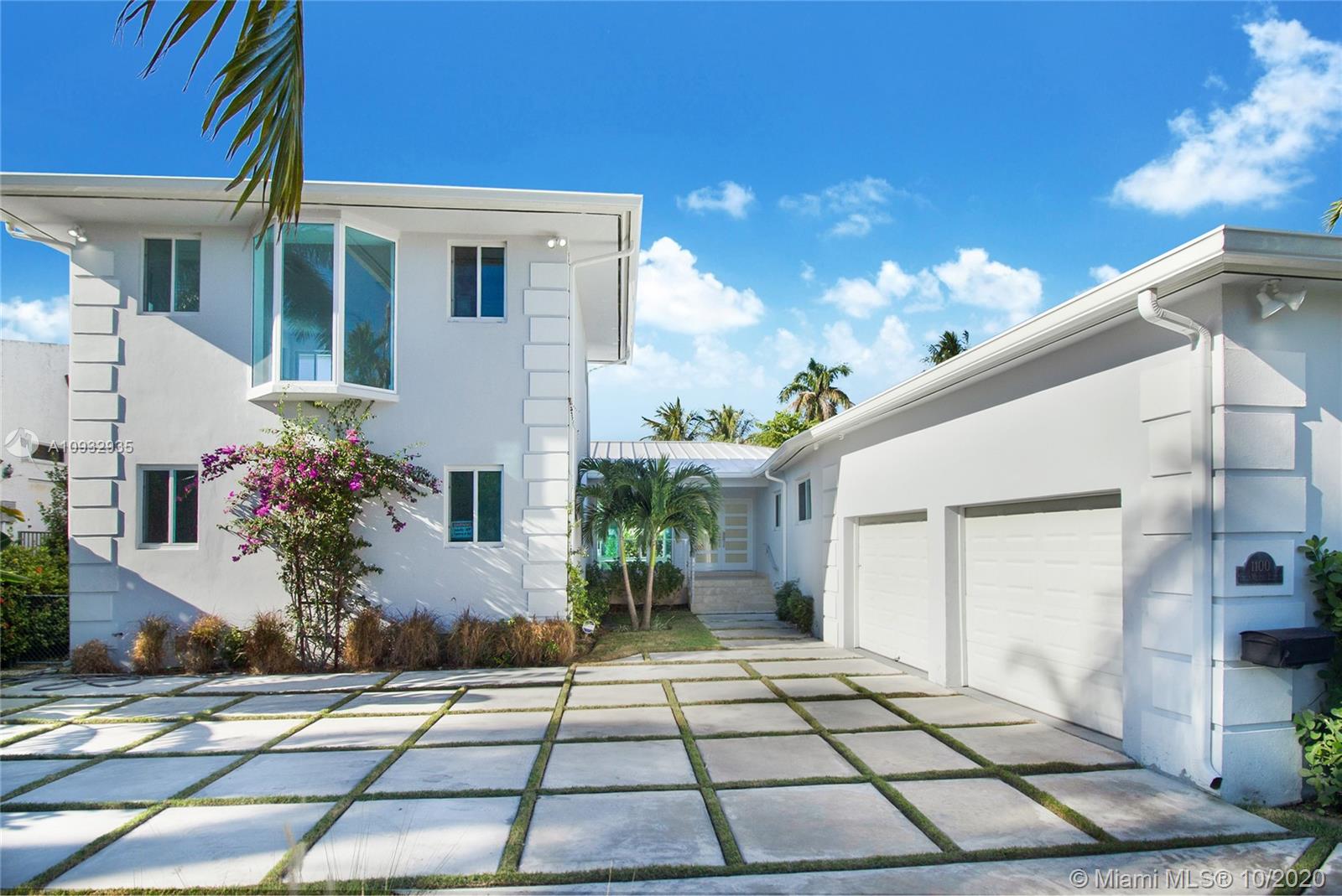 Contemporary waterfront, completely rebuilt new construction with luxury details. Open and bright floor-plan with water views. Two master bedrooms, walk-in closets, gourmet kitchen, All New hurricane impact doors and windows. New metal roof. Large pool, lush tropical garden yard, double car garage, great dockage on deep and quiet canal. 1/2 block from the wide bay with 58 Linear FT of water frontage. 24/7 double guards security gate. Vacant - Ready to move, will not last! Easy to show.