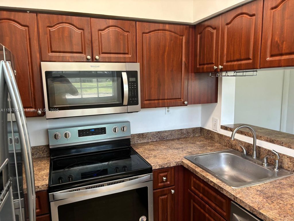 Photo of 620 Cypress Club Way #I13, Deerfield Beach, FL 33064 (MLS # A11897936)