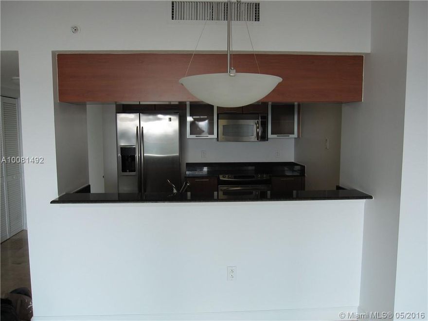 Immaculate large one bedroom/one bathroom unit in the heart of downtown. Marble Floors, granite countertops, stainless steel appliances, washer dryer in unit, walk in closet, large balcony, impact windows. High floor with great sunset view. Full service building in front of Margaret Pace park. Many amenities... pool, spa, gym, doorman. Must make appointment.