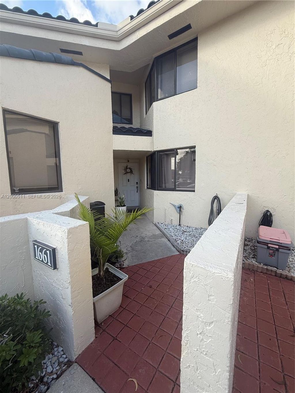 Photo of 1661 NW 81st Way #1661, Plantation, FL 33322 (MLS # A12000511)