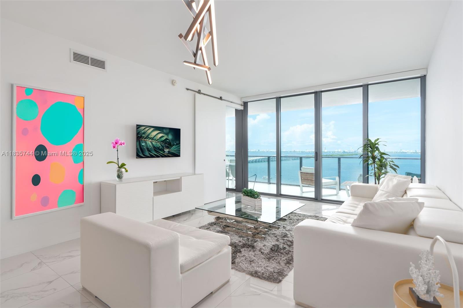 Enjoy breathtaking panoramic views of Biscayne Bay and Miami's skyline from this luxurious unit in the iconic new waterfront development at One Paraiso Condo by renowned designer Piero Lissoni. Unit features 1BD+Den/1.5BA, 959sf, private elevator & foyer, 9ft ceiling windows, completely finished with $80k worth in upgrades, electric blackout shades, Sub-Zero & Wolf appliances. Bring your toothbrush, unit comes **FULLY FURNISHED* as shown on photos, TV's included. State-of-the-art amenities: tennis & basketball courts, sunrise & sunset pools, jacuzzi, beach club, gym, spinning room, spa, sauna, steam room, movie theater, kids indoor playroom, boat dock, Amara Restaurant by famous chef Michael Schwartz, and more...