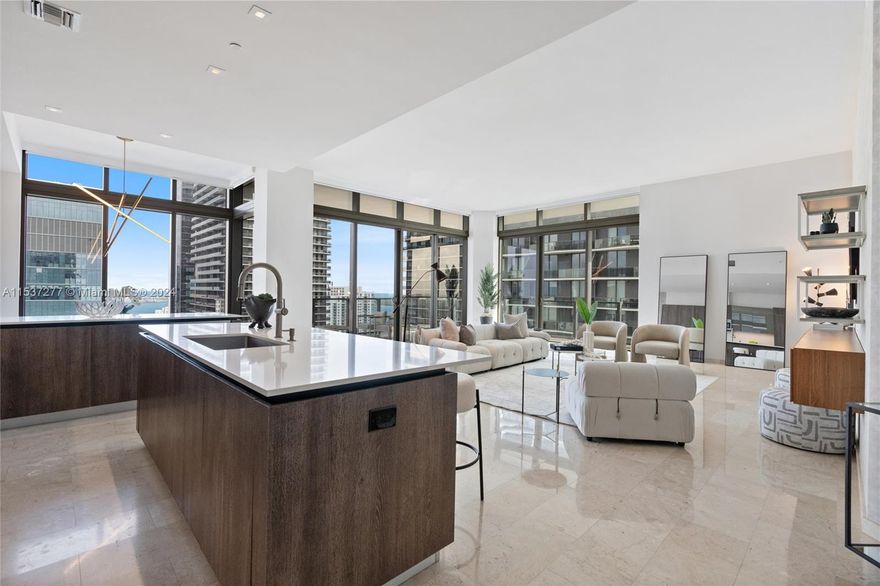 Stunning corner unit 4 BED,4.5 BATH+SERVICE QUARTERS, 3,244sqft interior. With 12-foot ceilings and 738 Sqft wrap around terraces with 180 degrees views of Brickell, the river and bay. One of only 10 unique units of TOWER SUITES which are a collection of luxury residences in the sky. The residence features ITalk raft-designed kitchen and bathroom cabinets, quartz stone countertops, and a controlled wine storage system. Enjoy the epitome of opulence with fully finished dressing rooms in the master bedroom, imported marble flooring, modern Italian kitchen cabinets, quartz stone countertops and backsplash, bathrooms with designer daze faucets.