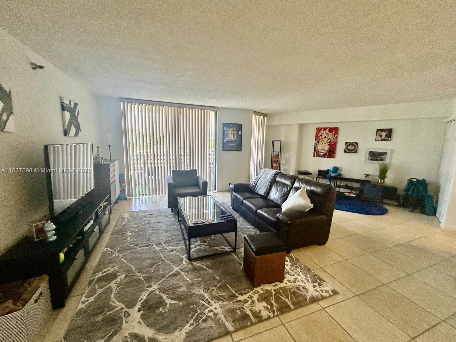 Spacious one bedroom with 2 full bathrooms that can be converted on a second bedroom with a bathroom in suite. Updated baths and kitchen, carpet on the bedroom and tiles on the rest of the apartment. One assigned covered parking. Nice building with renovated lobby and hallways, with gym and swimming pool. Great location on Aventura, walking distance from the Mall and Parks and few minutes from the beach. Rented until March 2026.