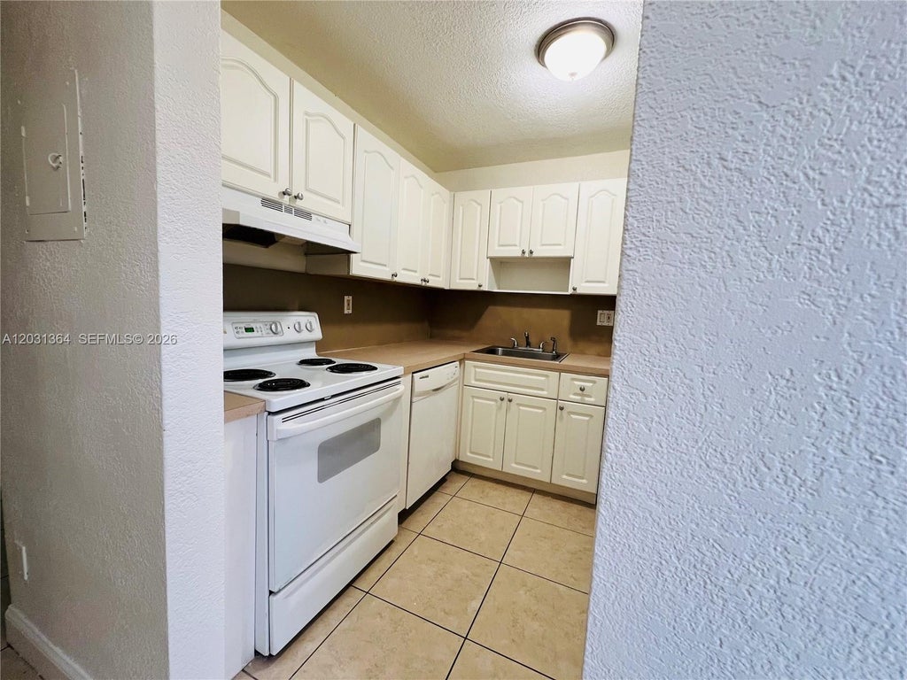 Photo of 2040 NW 89th Ave #104, Pembroke Pines, FL 33028 (MLS # A12031364)
