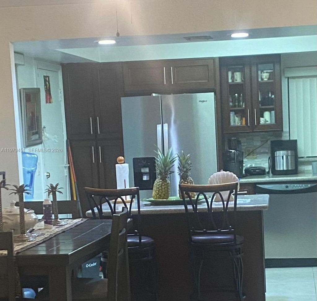 Photo of 6010 S Falls Cir Dr #222, Lauderhill, FL 33319 (MLS # A11979451)