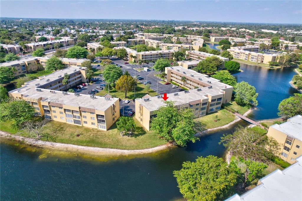 Photo of 5860 NW 64th Ave #102, Tamarac, FL 33319 (MLS # A12011944)