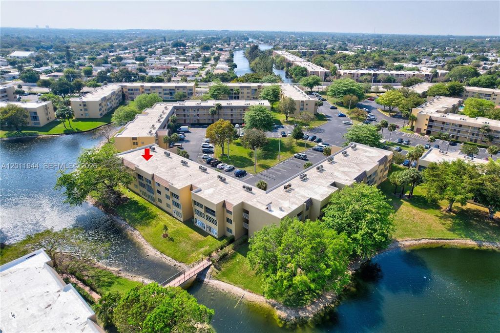 Photo of 5860 NW 64th Ave #102, Tamarac, FL 33319 (MLS # A12011944)