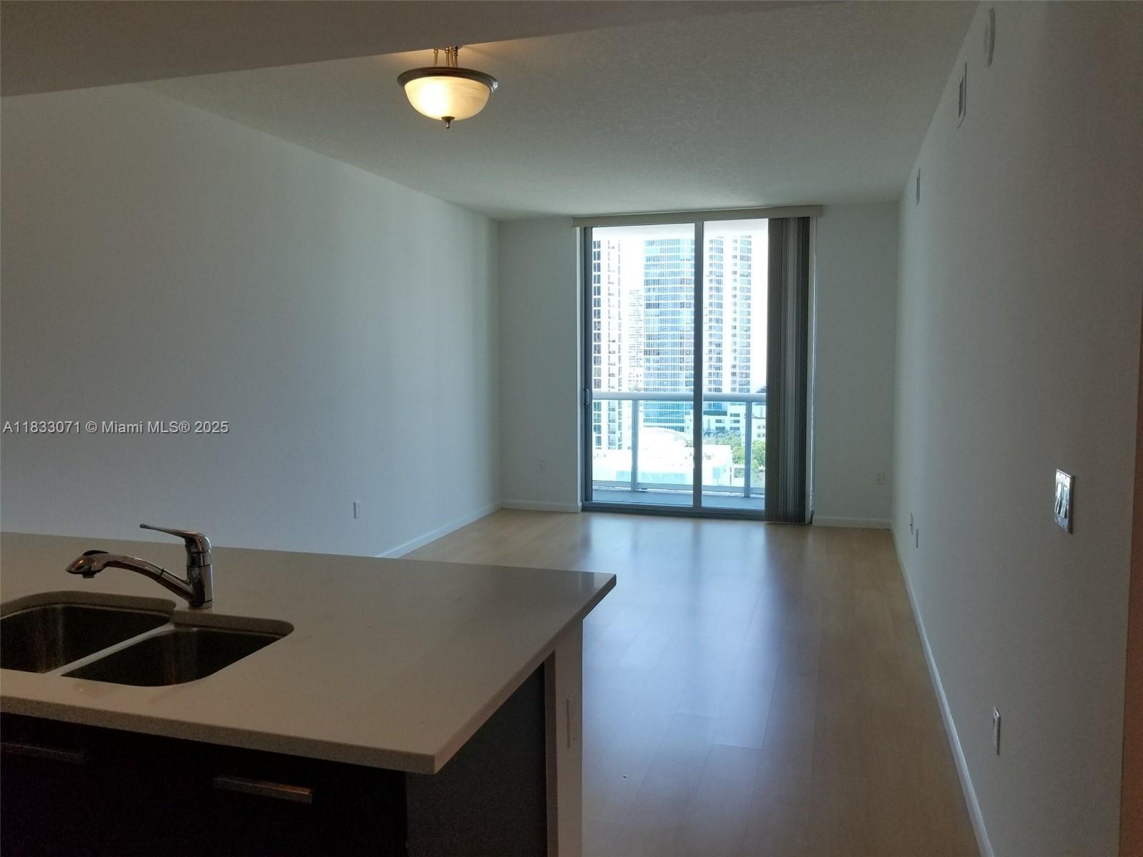 Spacious one-bedroom unit with plenty of natural light, featuring stainless steel appliances and modern kitchen cabinets. It has laminate wood flooring and blinds/screens. Access to balcony on living room and bedroom. Main lobby with 24-hour front desk, stunning infinity pool with jacuzzi and ample sundeck, clubroom and GYM. Professionally managed throughout the entire lease. NO SHORT TERM RENTALS (ARIBNB, ETC.) PERMITTED. Renter's insurance required. Unit is being painted/cleaned.