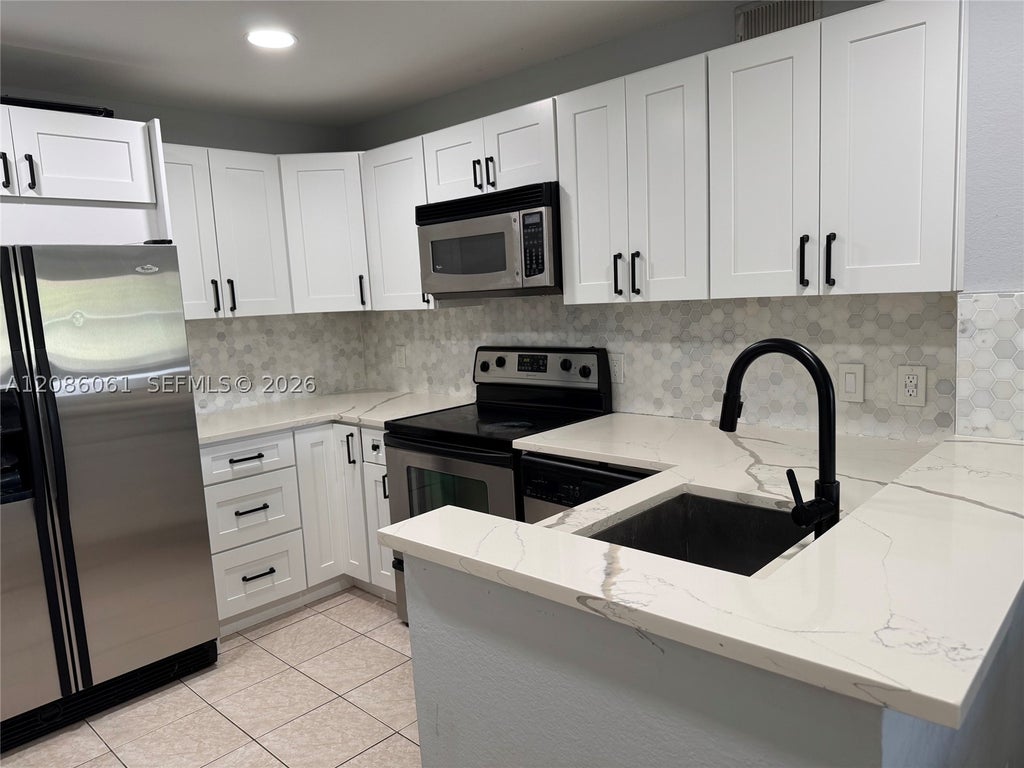 Photo of 1825 Palm Cove Blvd #7-303, Delray Beach, FL 33445 (MLS # A12086061)