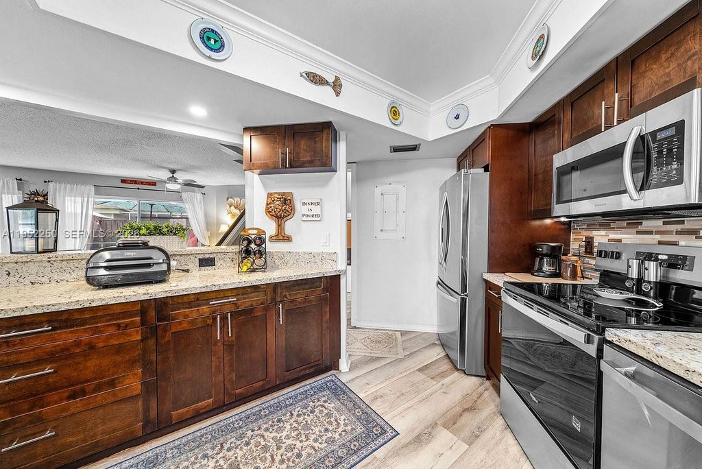 Photo of 11625 Winchester Dr #B, Palm Beach Gardens, FL 33410 (MLS # A11952250)