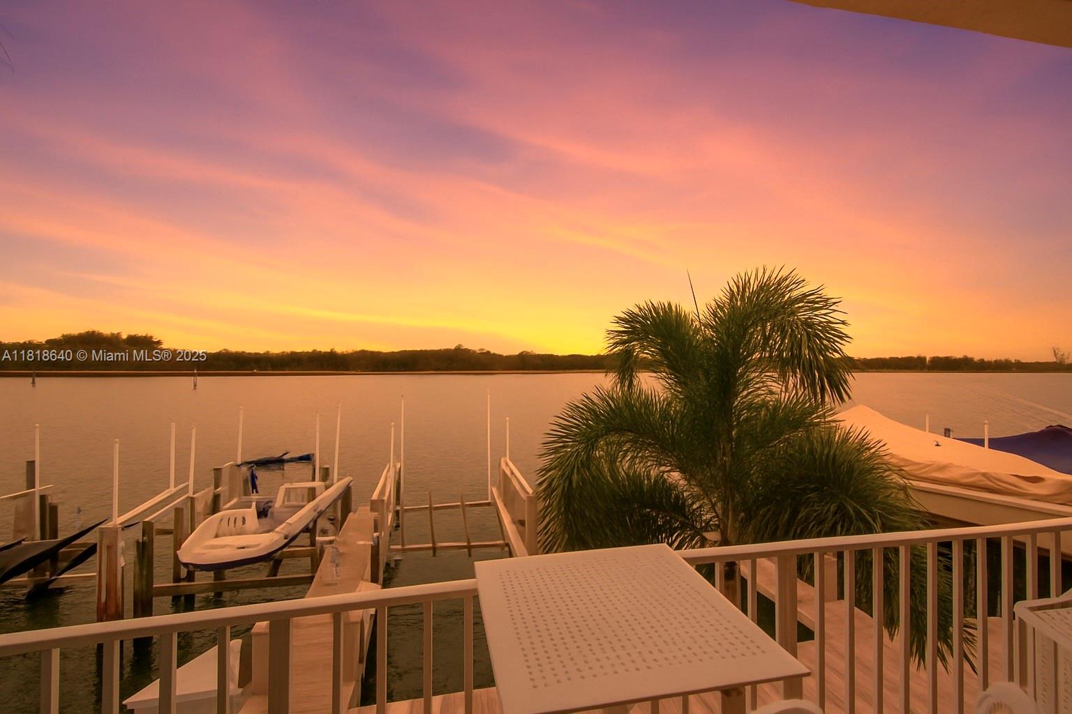 Rare opportunity—3 bed / 3.5 bath waterfront townhome with deeded dock and 24,000 lb boat lift right behind the unit! Dock fits up to a 45-ft boat (depending on piling). Direct ocean access, no fixed bridges, across from North Beach and a natural preserve. Gated community, just steps to the Atlantic Ocean and Hollywood Beach—ideal for boaters and beach lovers. Professionally renovated with impact windows & doors, abundant light, chef’s kitchen with quartz waterfall island, high-end appliances, floating staircase, and 3.5 luxury baths. Includes 1-car garage, plenty of closet space. Enjoy 2 waterfront pools, sunsets from your dock. Pet-friendly, all ages, low HOA. Turnkey lifestyle!