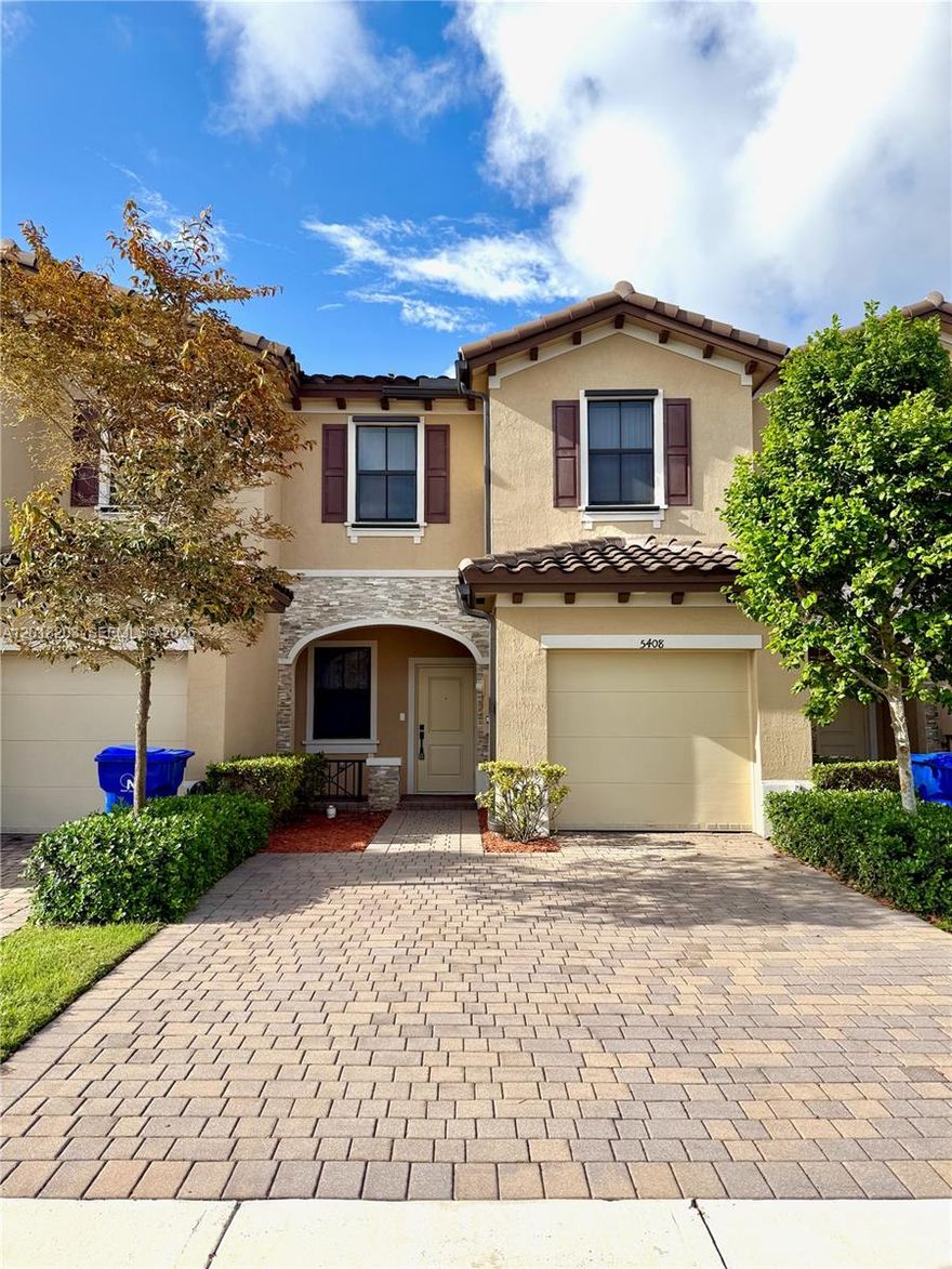Built in 2021, this contemporary gated-community townhome offers a practical blend of modern features and convenience with an incredibly low $177.93/month HOA, the ability to lease right away, and a pet-friendly policy for pets up to 20 lbs. The bright, open interior is filled with natural light and features waterproof/scratchproof vinyl flooring throughout, leading to a functional kitchen complete with Calacatta quartz countertops, stainless steel appliances, a pantry, and a large countertop area perfect for dining. All three bedrooms are located on the second floor alongside the laundry room for maximum convenience, including a primary suite with a walk-in closet, double-sink vanity, and walk-in shower. Every bathroom is finished with porcelain tile, including a soaking tub in the second bath. This home is designed for efficiency and peace of mind, featuring full impact windows and doors, a tankless water heater, a 1-car garage, and an attic for extra storage. Outside, enjoy a private, fenced-in backyard with pavers and no rear neighbors, plus parking for three vehicles and ample guest spaces nearby—all located just minutes from major expressways.