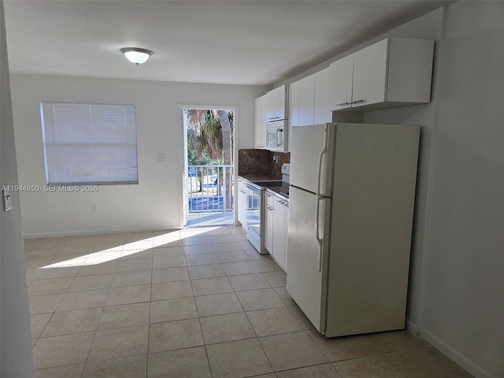 Photo of 2401 Van Buren St #Unit 14, Hollywood, FL 33020 (MLS # A11944950)