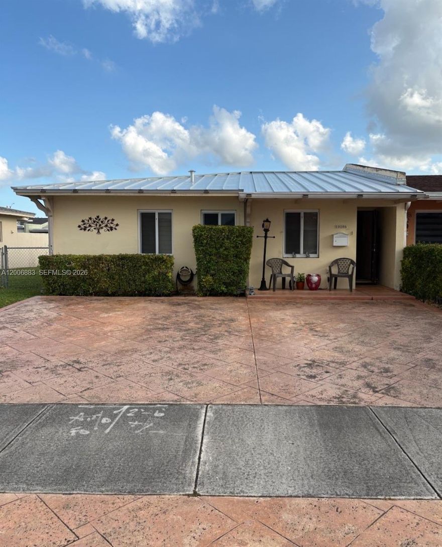 Great opportunity to buy a house at a reasonable price. Corner advantage 3/2 Twin Home in a very good Westchester neighborhood. Impact windows, updated appliances including washer dryer, kitchen with granite countertops and wooden cabinets, tiled floors. Quality metal roof, Make it possible.
