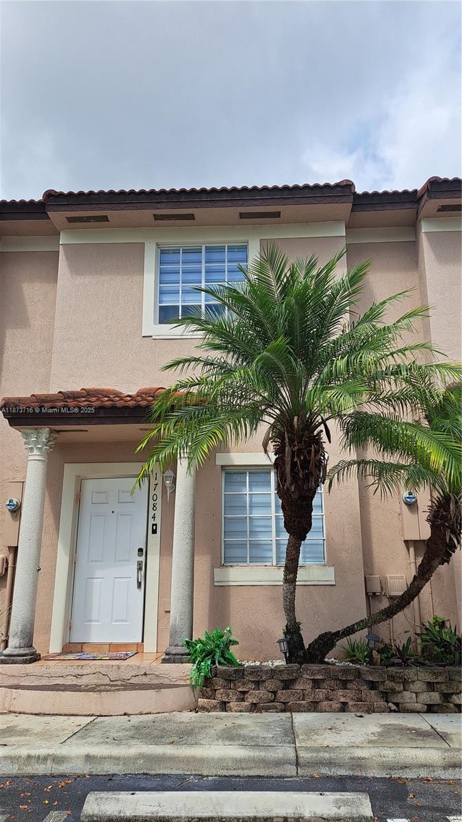 Welcome to this charming 2-bedroom, 2.5-bathroom townhome in the Cazadores community. The first floor features bright, open living space with tile flooring and modern light fixtures. The kitchen is a dream with stainless steel appliances. Outside, you'll find a private, fenced patio with travertine pavers—perfect for relaxing. The spacious master bedroom upstairs offers a cozy escape with wood flooring and its own private balcony. The home also includes a laundry room with custom shelving. With no rear neighbors, two assigned parking spots and a great location near shopping and major highways, this home has it all!