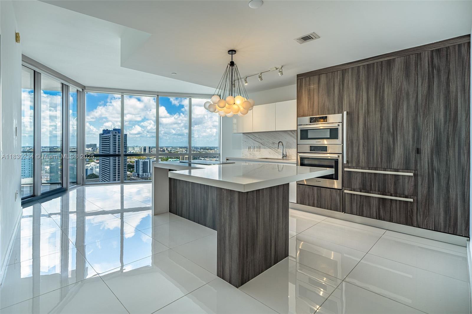 Impeccable 1 bed, 2 bath + converted den at the iconic Paramount Miami Worldcenter. Enjoy a spacious layout with private elevator foyer, high ceilings, modern open kitchen with Italian cabinetry, premium appliances, full-size washer & dryer, and large balcony with sunset views. Primary suite features walk-in + linen closets and a spa-style bath. Resort-style amenities include 5 pools, bungalows, BBQ area, fitness center, boxing, basketball, racquetball, soccer field, tennis, golf simulator, game room, kids' playroom, movie theater, business center, yoga studio, food market, coffee bar, and more. 24/7 front desk, valet, and security. Ready for immediate occupancy!