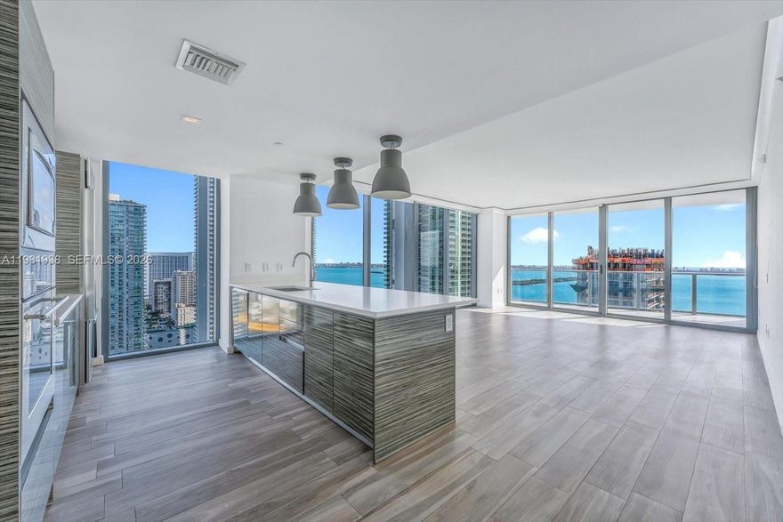 Don’t miss this exceptional opportunity — a turn-key corner residence on the 33rd floor at Icon Bay in Edgewater. This corner unit features 2 bedrooms plus a den and is wrapped in floor-to-ceiling windows showcasing spectacular, unobstructed bay and skyline views from every room.
The rare flow-through layout offers two private balconies: an East-facing terrace off the living room for beautiful sunrises over the bay and a West-facing balcony from the primary suite for dramatic Miami sunsets. Residents at Icon Bay enjoy resort-style amenities, including an infinity pool overlooking the water, state-of-the-art fitness center, sky lounge, tennis courts, theater room, 24-hour security, and valet service.
Perfectly positioned just minutes from Miami’s best dining, shopping, and cultural destinations — and only about 12 minutes from Miami International Airport — this residence delivers an exceptional blend of value, elegance, and convenience in one of Miami’s most desirable waterfront neighborhoods.