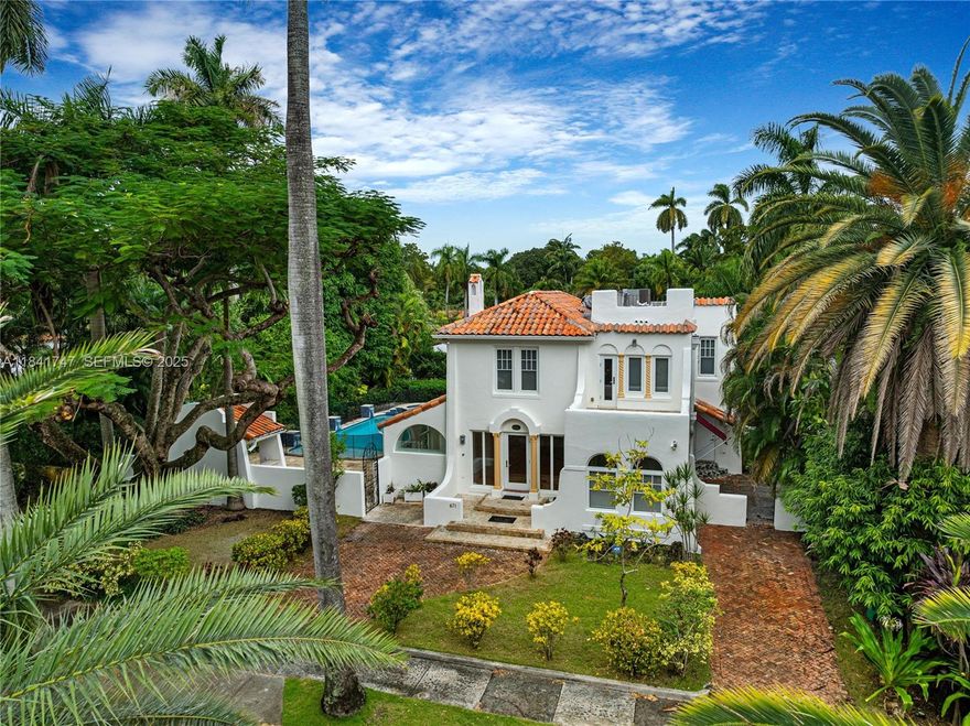 Grand residence in the heart of guard-gated Morningside, set on an oversized, lushly landscaped lot, 10,038 SF, just one block from the bay! This Mediterranean beauty was remodeled to perfection, offering 3 BD & 2.5 BA + 1/1 guest house. Boasting sophisticated interiors, a chic great room with fireplace, gleaming wood floors, a white & light eat-in kitchen with breakfast nook & wine fridge, & spacious bedrooms including the primary with sitting area & gorgeous bathrooms. Outside enjoy a covered patio, stunning pool, spa, outdoor shower, & summer kitchen. The guest house features a bedroom & bathroom, living room, kitchenette, ample storage, & central A/C. Perfect for extended family & overnight guests! Close to top schools: Cushman & Miami Country Day. 15 mins to MIA Airport! Mins to 40+ acre park w/ lighted tennis & basketball courts, football field, walking trails, picnic & bbq areas, pool, boat ramps, & kayak rentals.