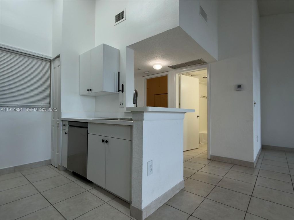 Photo of 2803 N Oakland Forest Dr #304, Oakland Park, FL 33309 (MLS # A11914881)