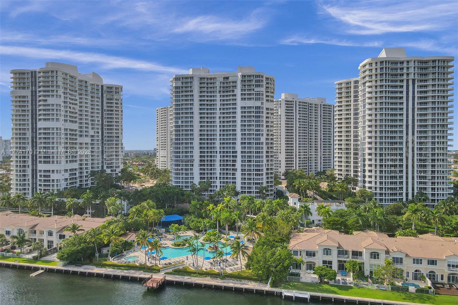 Bright and spacious corner unit in move-in condition. 2 bedrooms, 2.5 baths. Panoramic views from 3 balconies. Wood floors throughout. Motorized shades. Formal dining room. Open kitchen with breakfast area facing the marina of the Waterways. Updated kitchen. Spacious master bedroom, walk in closets. Resort lifestyle: 3 pools, tennis courts, spa, fitness center and clubhouse. Outdoor café, BBQ area & kids' playground. Walking distance to restaurants and shops.
