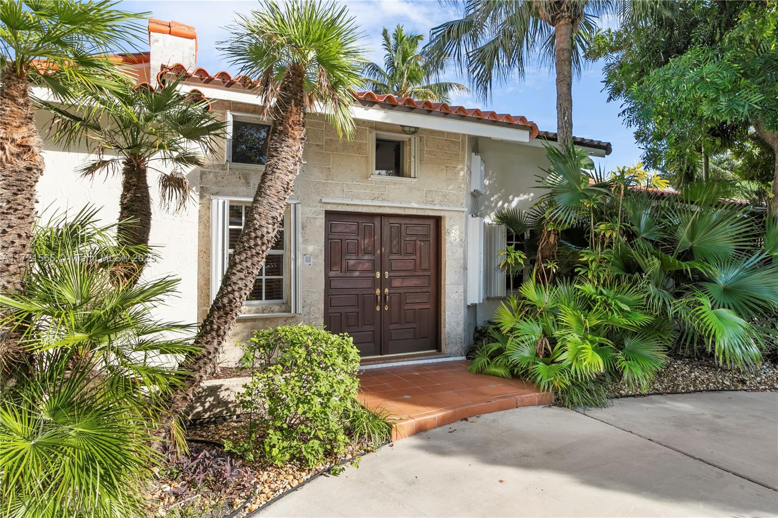 Discover an incredible opportunity to own a custom-designed home in prestigious Key Biscayne. Originally a Mackle home, this 4BD/4BA residence has been transformed to offer charm, character, and endless potential. Set on a 7,500 sq. ft. lot, the 2,500 sq. ft. interior boasts an open layout filled with natural light and soaring ceilings that create a grand sense of space. The primary suite is a peaceful retreat with its own en-suite bath. A circular driveway adds elegance, while the barrel tile roof enhances curb appeal. The fenced backyard offers privacy and space for outdoor living. While the home is ready for updates, its solid infrastructure provides the perfect canvas for customization. Enjoy Key Biscayne’s top schools, parks, beaches, and world-class amenities just moments away.